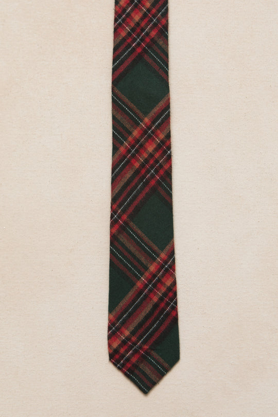 green and red plaid mens tie on a cream background 