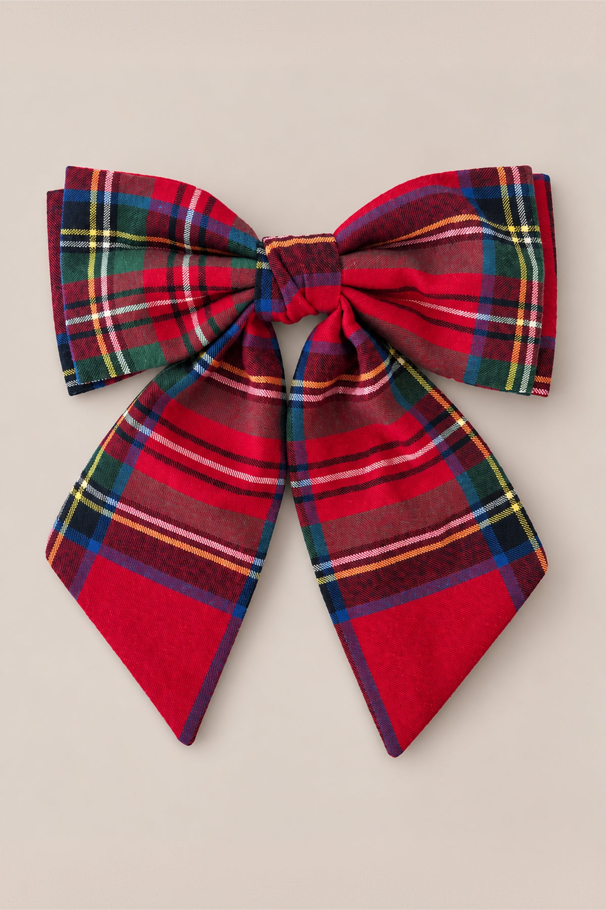 The Ivy City Co Hair Bows in Holiday Plaid features a large red plaid cotton flannel bow with green, yellow, and white stripes, displayed against a plain beige background.