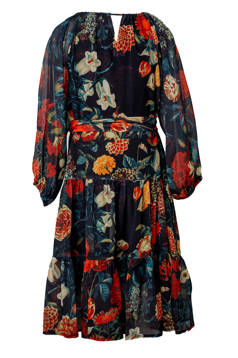 The Mini Imogen Dress in Moody Floral by Ivy City Co is a knee-length, long-sleeved dress with a vibrant red, yellow, orange, and white floral pattern, a flowing fit, and a belted waist for effortless style.