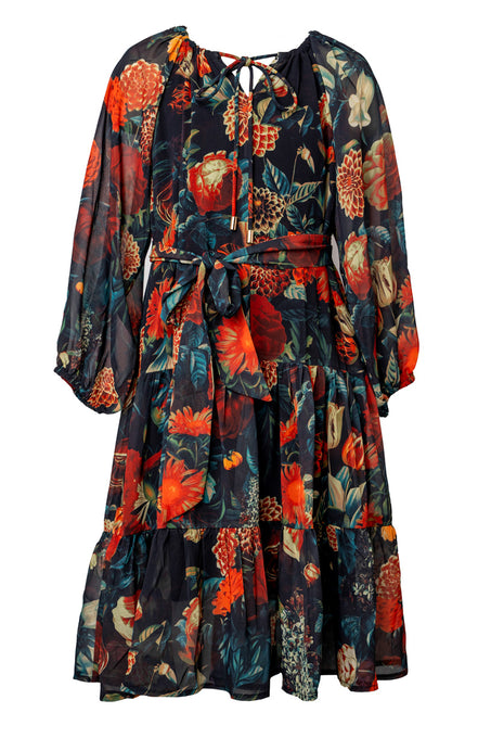 The Mini Imogen Dress in Moody Floral by Ivy City Co features vibrant red, orange, and green blooms on a dark background, with long sleeves, a belted waist, and ruffled skirt—perfect for matching dresses with your little one.