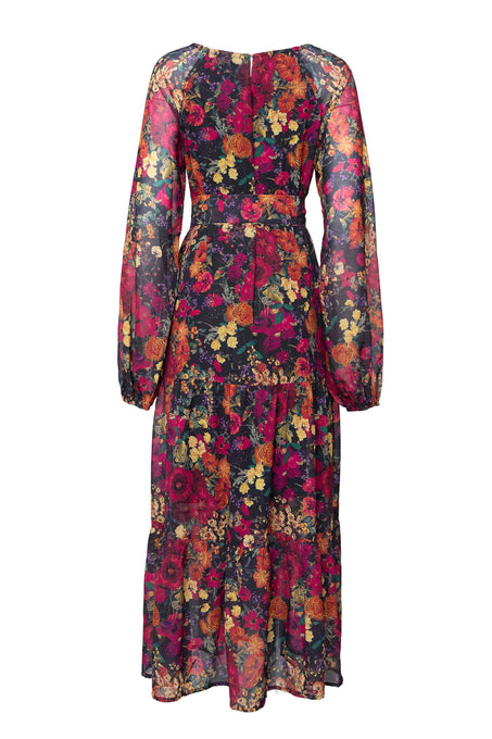 The Imogen Dress in Night Garden by Ivy City Co is a maternity-friendly, long-sleeved, ankle-length fall floral maxi with a fitted waist and bright red, orange, yellow, and green blooms on a dark background, shown from the back.