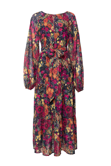 The Imogen Dress in Night Garden by Ivy City Co is a long-sleeved, ankle-length fall floral maxi with a vibrant red, yellow, and purple print. It features a waist tie, round neckline, sheer lightweight fabric, and is maternity-friendly.