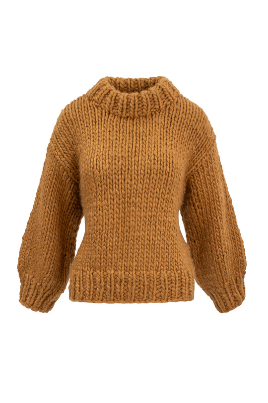 brown knit sweater against a white backdrop