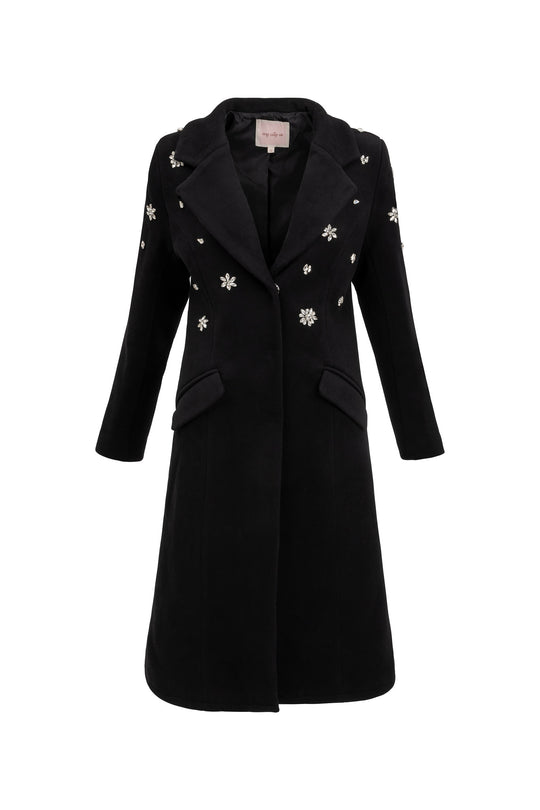 Black coat with floral embellishments on a white background