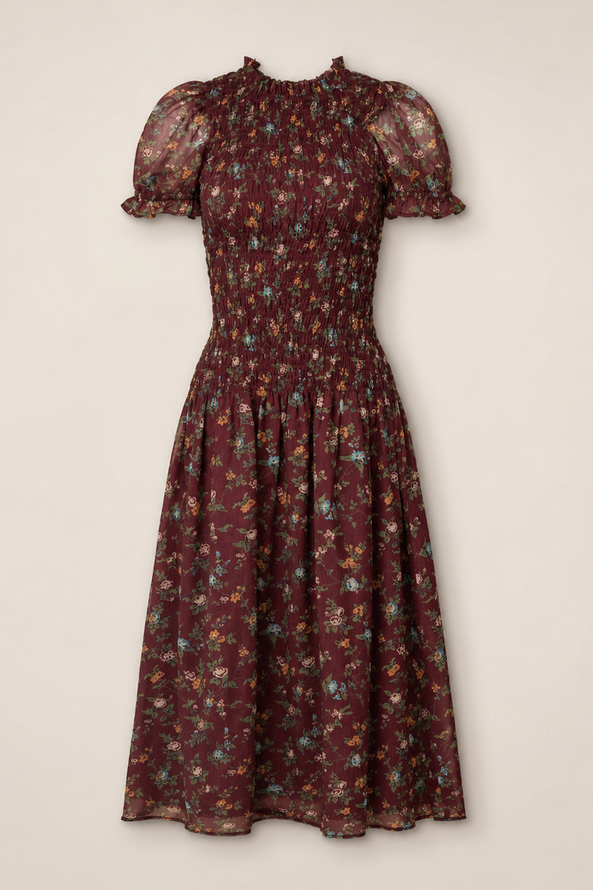 The Jennifer Dress in Aubergine Elysian Vine by Ivy City Co is a midi dress featuring a smocked bodice, puff sleeves with ruffle trim, and a flared skirt adorned with multicolor ditsy floral print on sheer fabric. Maternity friendly and effortlessly stylish, it provides both comfort and charm for any occasion.