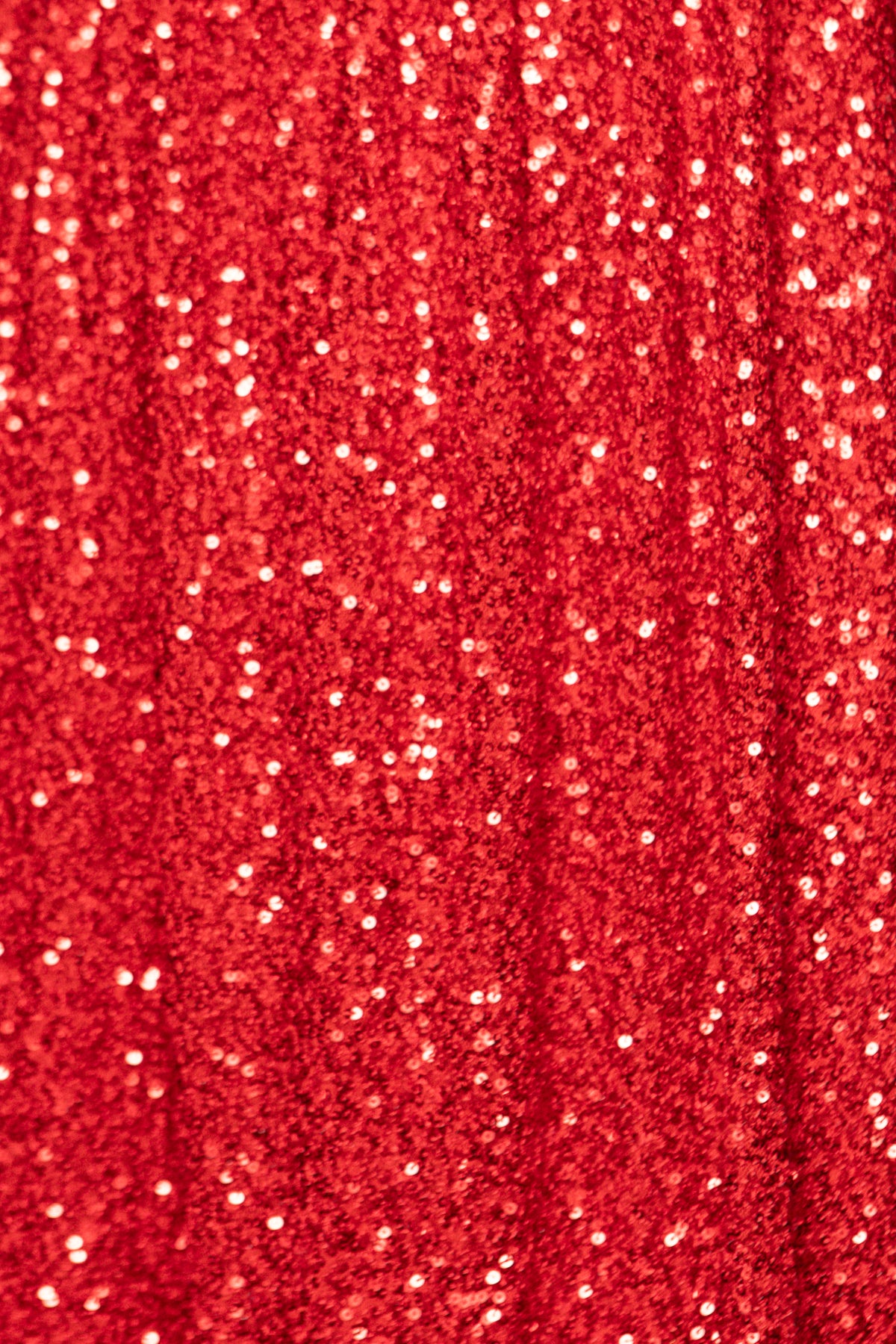 Close-up of red fabric with glittery texture