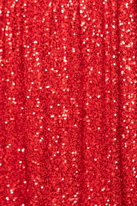Close-up of red fabric with glittery texture
