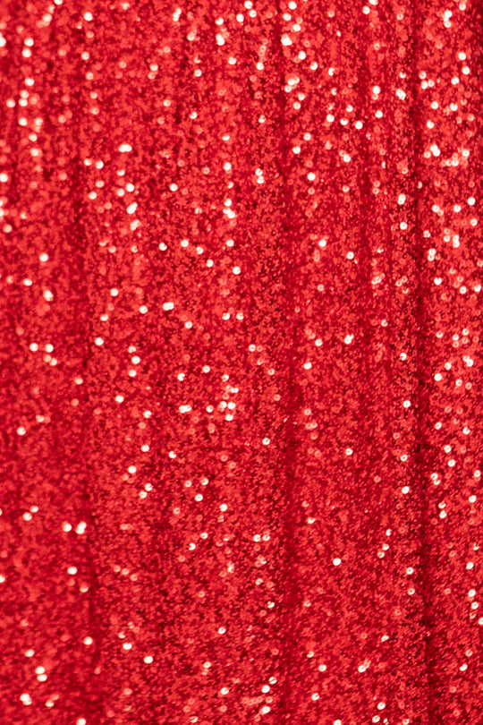 Close-up of red fabric with glittery texture