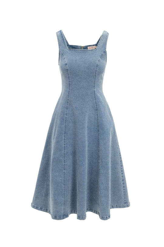 The Joanna Dress in Denim by Ivy City Co features a sleeveless, light blue design with a square neckline, fitted bodice, and A-line skirt. Visible seams add vintage charm and its maternity-friendly fit ensures comfortable style.