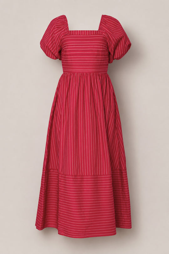 An ankle-length Julie Dress in Cranberry Pinstripe by Ivy City Co, featuring red fabric with white vertical pinstripes, short puff sleeves, a square neckline, a fitted smocked bodice, and a flared skirt.