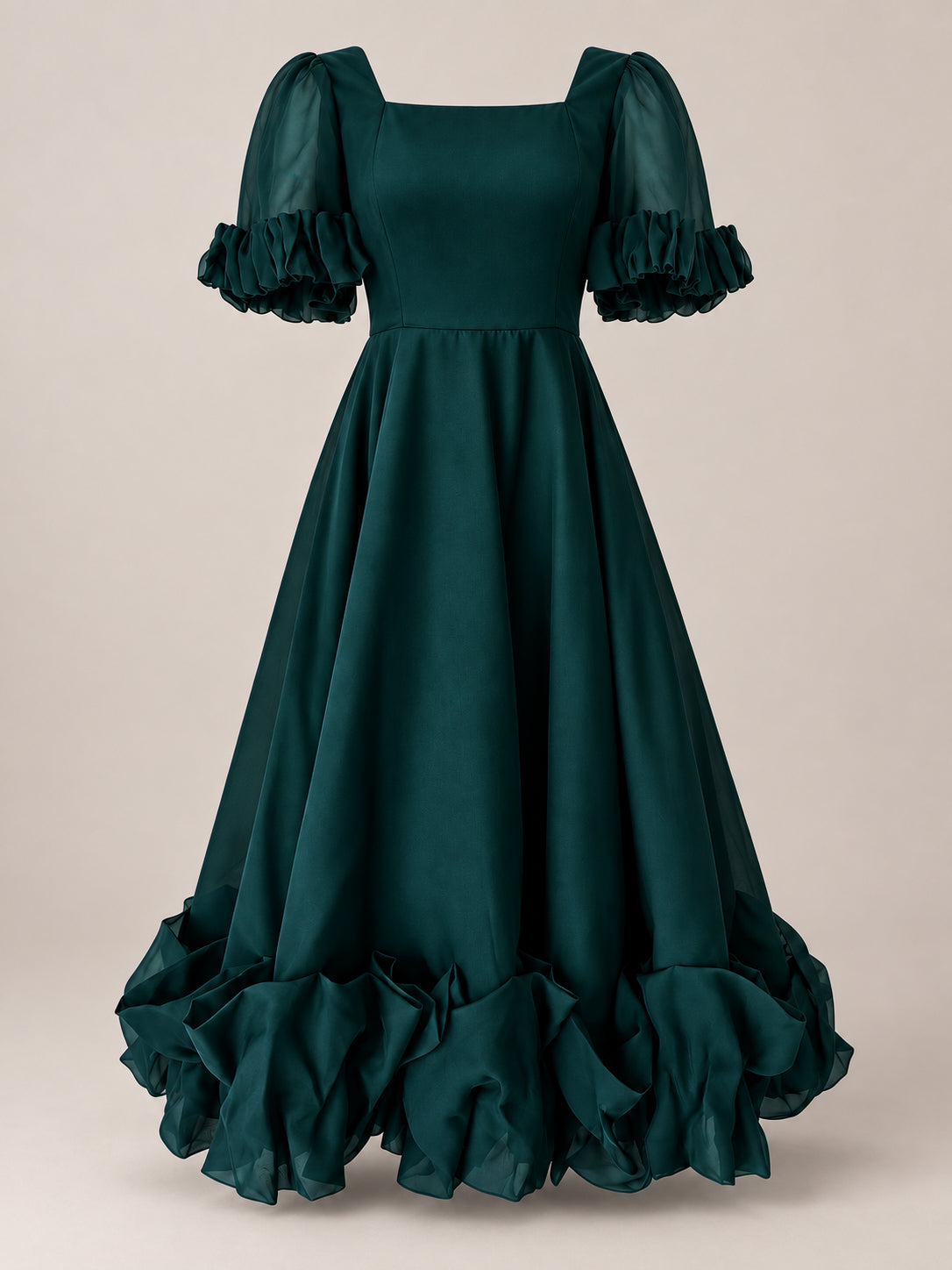 Introducing the Kendy Dress in Emerald by Ivy City Co—a floor-length, dark green gown featuring short puffed sleeves and a flattering square neckline. Delicate ruffled accents adorn the sleeves and hem, creating a voluminous silhouette that exudes elegance. Perfect for holiday parties or making a grand entrance on Christmas Eve.