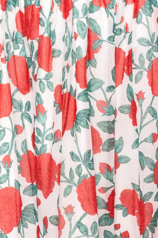 Floral pattern with red flowers and green leaves on a white background