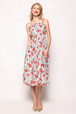 Woman wearing a floral dress on a white background