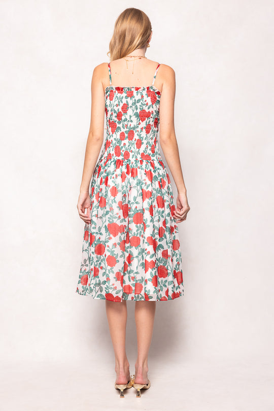 Woman wearing a floral dress on a white background