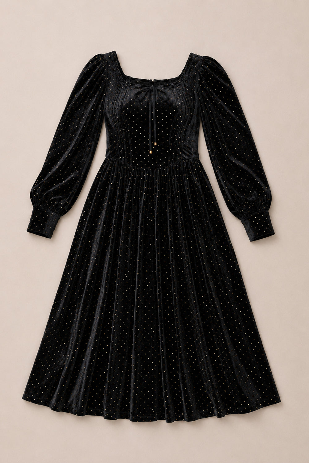 The Kingston Dress in Black by Ivy City Co is a stunning black velvet midi dress featuring long puffed sleeves, a square neckline, and shimmering gold polka dot embellishments. This elegant dress offers a fitted bodice and a flared skirt, beautifully displayed on a neutral background.