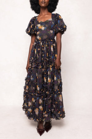 Woman wearing a floral dress on a white background