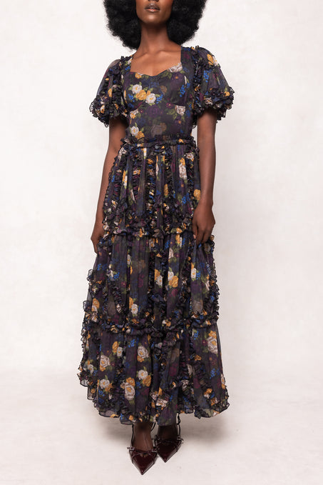 Woman wearing a floral dress on a white background
