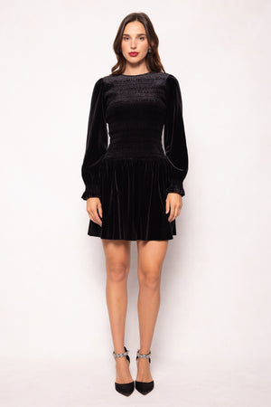 Woman wearing a black dress on a white background
