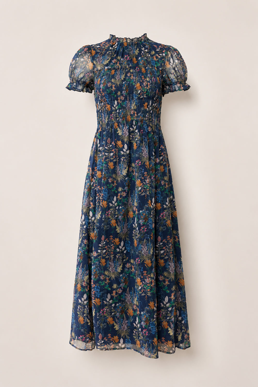 Discover the Leonora Dress in Midnight Autumn Bouquet by Ivy City Co—a navy blue, midi-length dress with short, sheer puff sleeves and a high ruffled collar. Featuring a beautifully smocked bodice, this elegant piece is decorated with an autumn-inspired floral print in orange, white, and green, and finished with a flowy skirt for effortless charm.