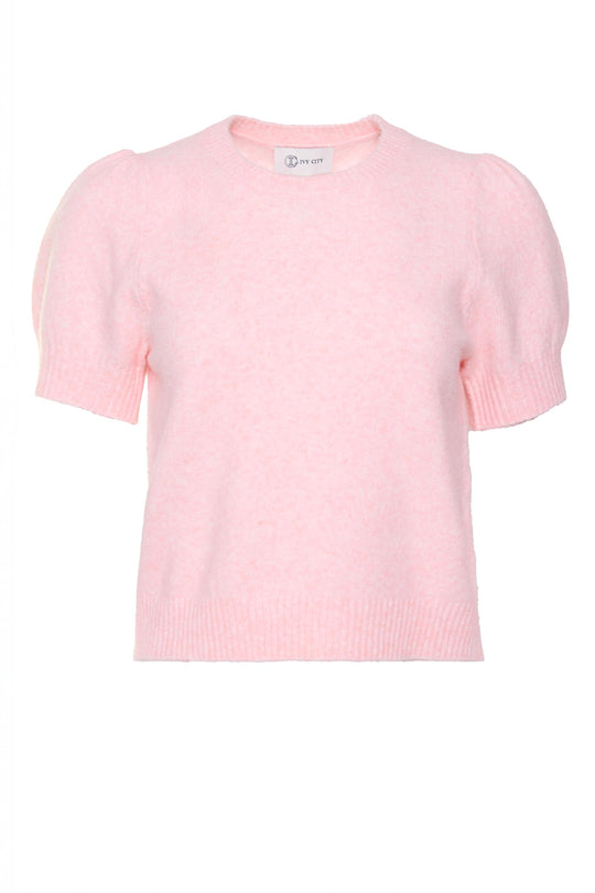 Pink sweater against a white background