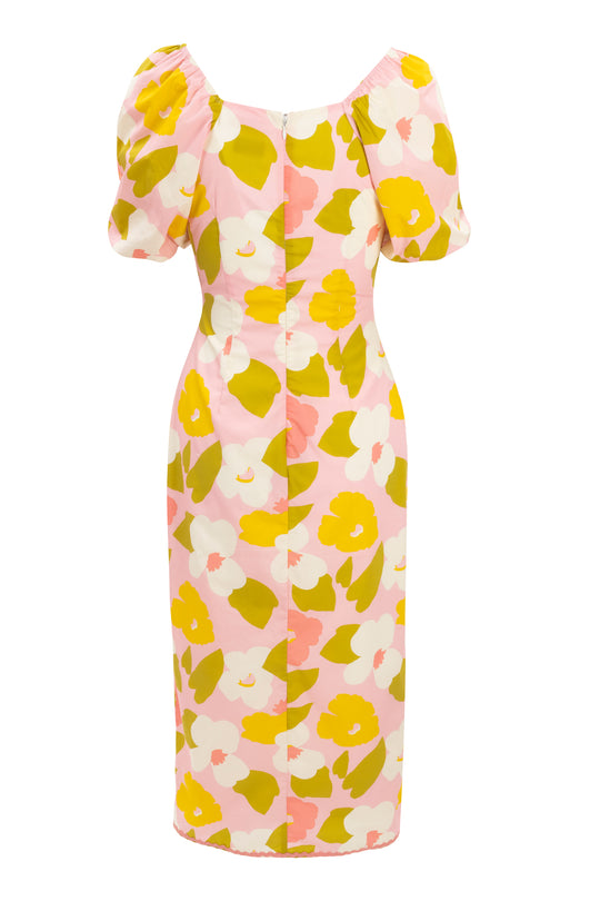 The Lula Dress Made With Liberty Fabric by Ivy City Co features a back view of a floral print in yellow, white, olive green, and pink on pale pink. It has short puff sleeves, a fitted silhouette, and a back zipper closure.