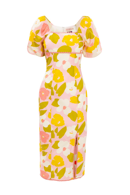 The Ivy City Co Lula Dress features Liberty Fabric-inspired yellow and white floral prints, short puff sleeves, an empire waist, and a front slit near the hem.