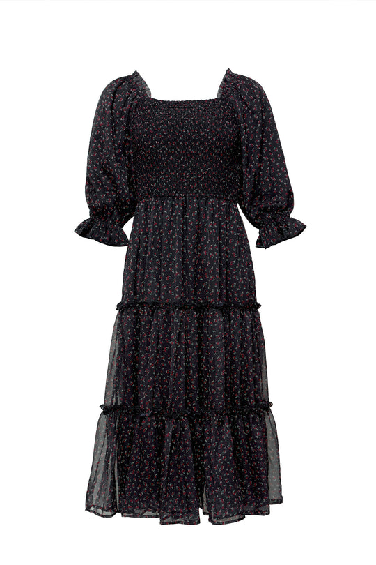 Black tiered dress with puff sleeves on a white background