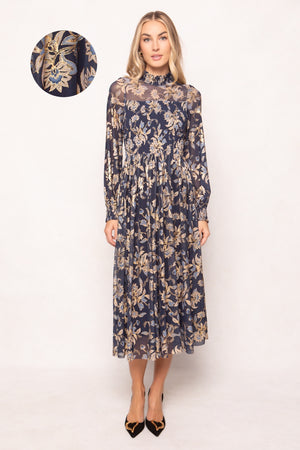 Woman wearing a floral dress with a close-up of the fabric pattern on a white background