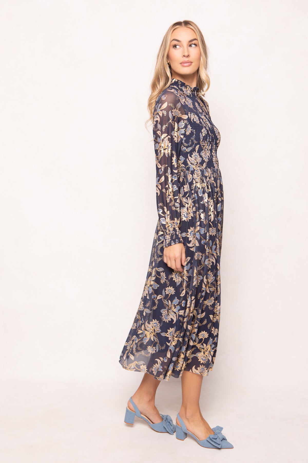 Woman wearing a floral dress on a white background