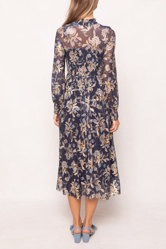 Woman wearing a floral dress on a white background