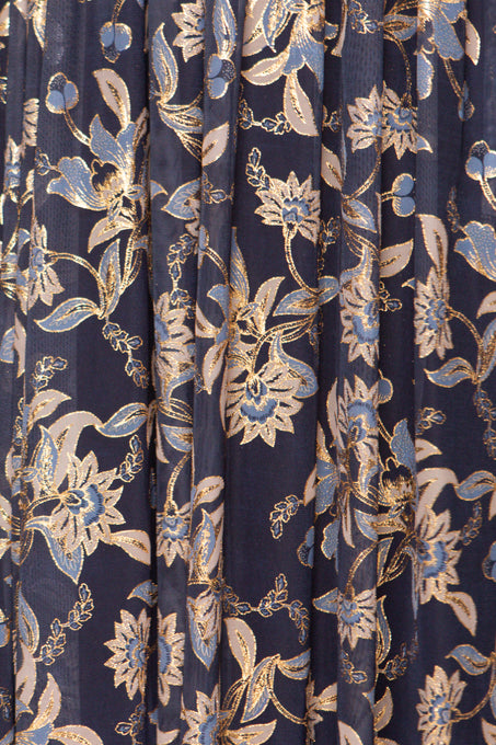 Navy blue fabric with gold and white floral pattern
