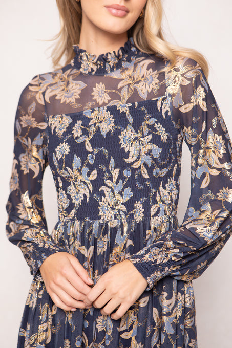 Navy floral dress with long sleeves on a white background