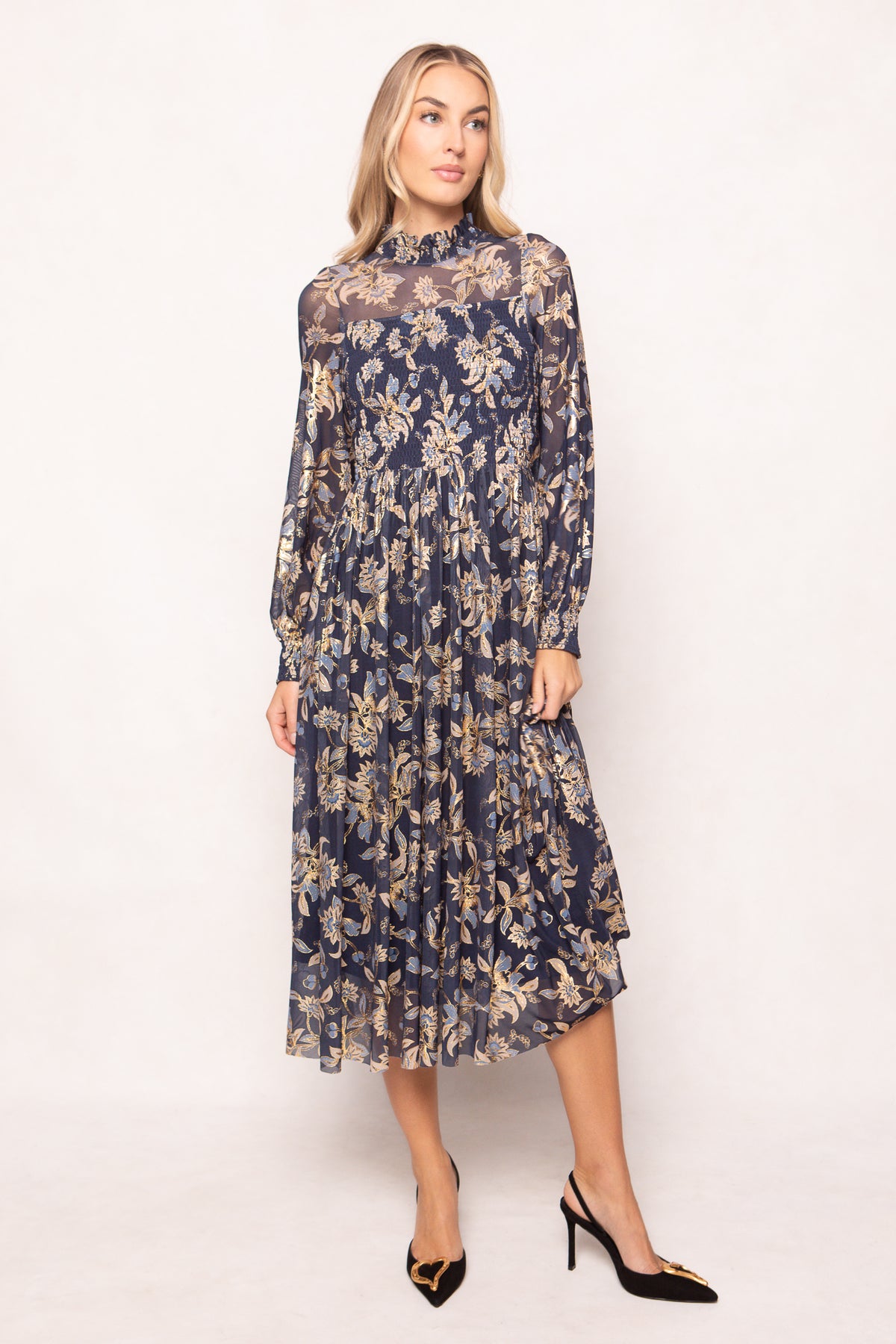 Woman wearing a floral dress on a white background