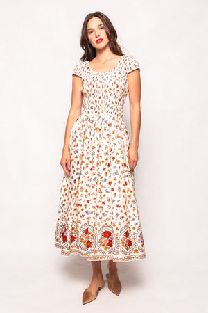 Woman wearing a floral dress on a white background