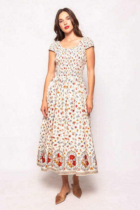 Woman wearing a floral dress on a white background