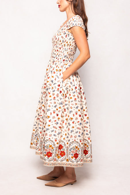 Woman wearing a floral dress with a white background