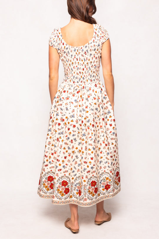 Woman wearing a floral dress on a white background