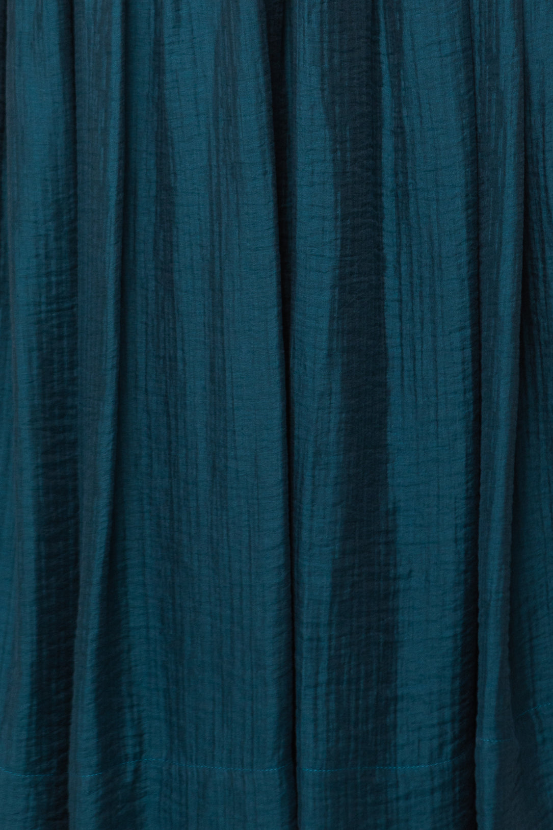 Close-up of textured teal fabric