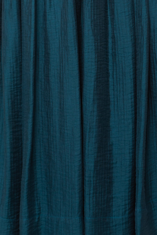 Close-up of textured teal fabric