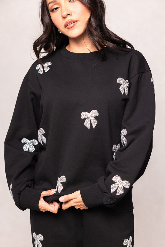 girl in a black sweatshirt against a white background