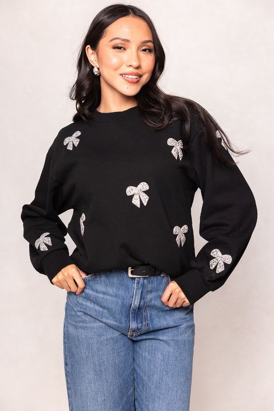 girl in a black sweatshirt against a white background