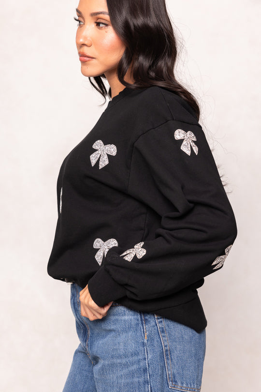 girl in a black sweatshirt against a white background