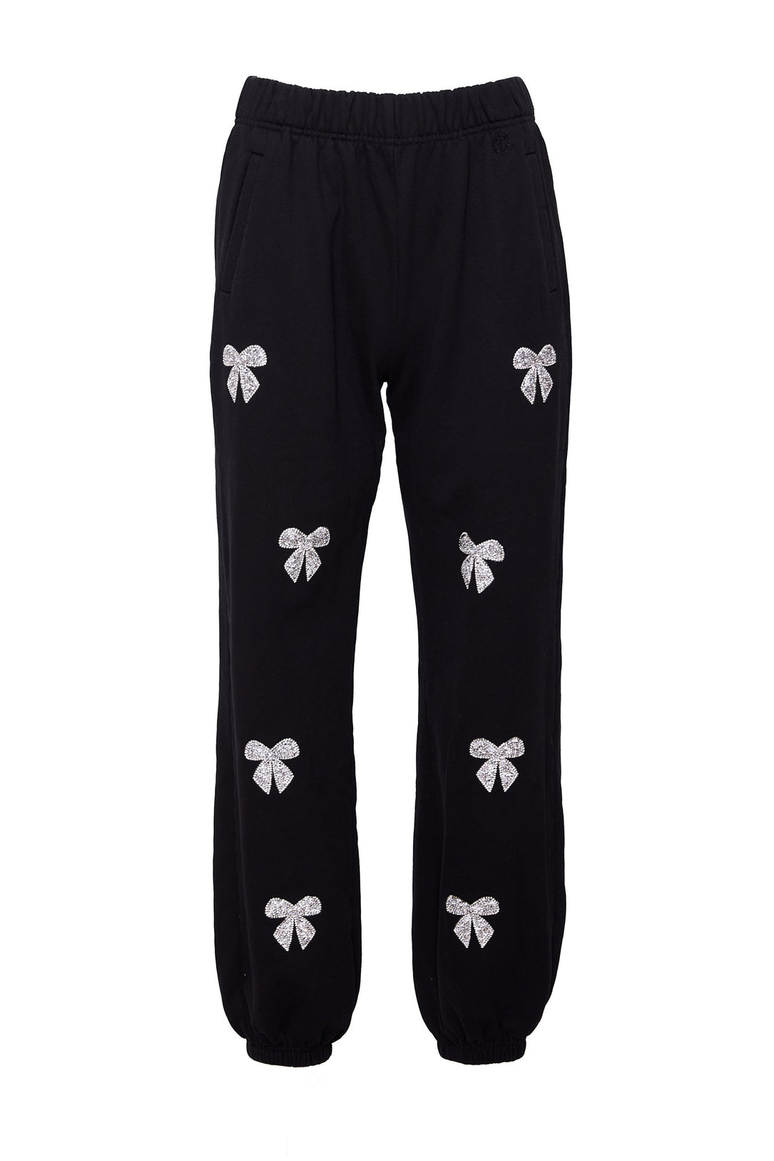 Black sweatpants with rhinestone bow detail against a white background