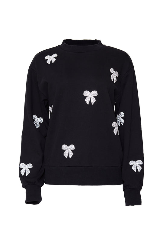 Black sweatshirt with rhinestone bow detail against a white background