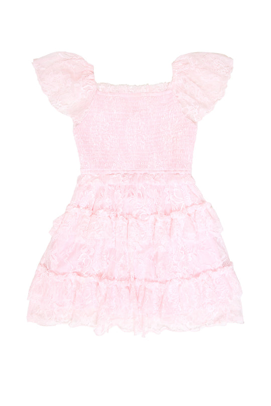 the back of a pink lace dress against a white background