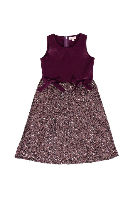 Purple dress with a glittery skirt on a white background