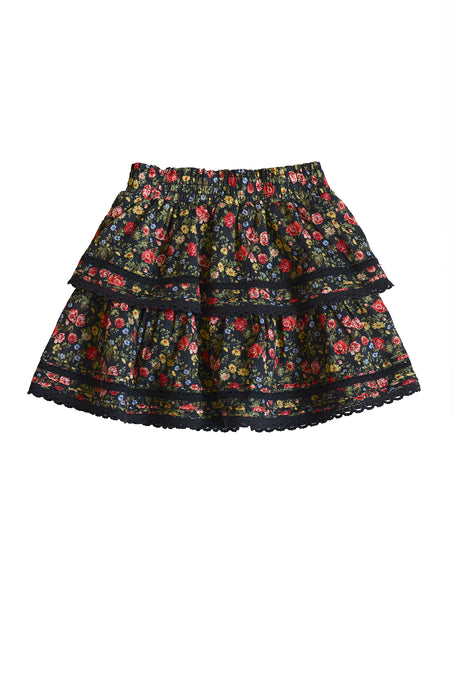 The Ivy City Co Mini Annalise Skirt in Obsidian Vintage Poppies is a girls’ wardrobe essential, showcasing a colorful floral pattern, tiered design, elastic waistband, and lace trim on the hem and tiers.
