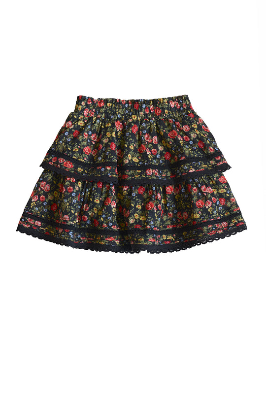 The Ivy City Co Mini Annalise Skirt in Obsidian Vintage Poppies is a girls’ wardrobe essential, showcasing a colorful floral pattern, tiered design, elastic waistband, and lace trim on the hem and tiers.