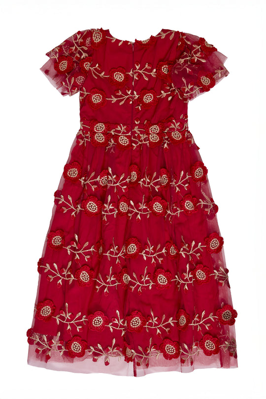 The back of a Red dress embroidered with gold floral details against a white background