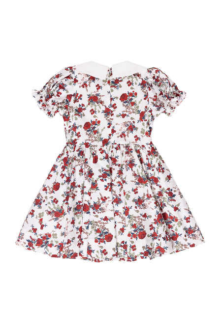 the back of a floral dress against a white background